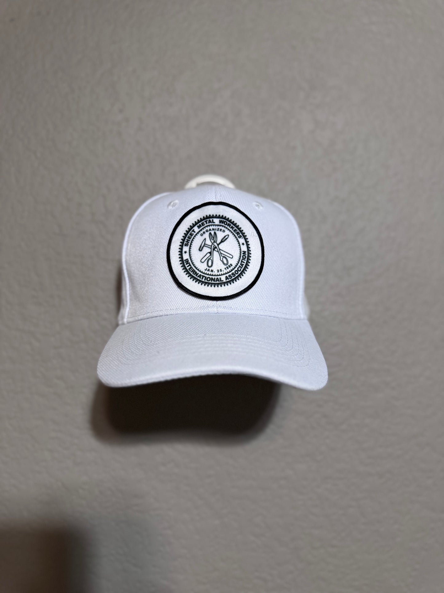 White baseball cap with a black brim